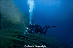 A diver making a video documentary on TETI wreck.  About ... by Gosia Nowodyla 
